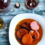 candied sweet potatoes in bowl topped with syrup #dessert #sweetpotatoes www.foodfidelity.com