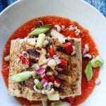 grilled mahi mahi in bowl with sauce and blackeyed pea salad