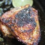 Pan Roasted Jerk Chicken Thighs in a pan