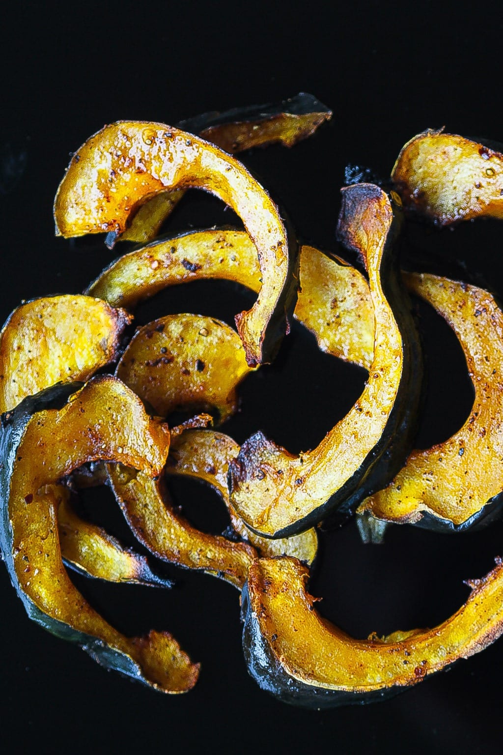 roasted acorn squash slices glazed with chili and honey topped with thyme