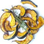 roasted acorn squash slices glazed with chili and honey topped with thyme